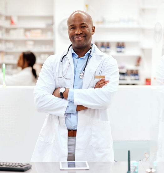 iStock-1135285181 male pharmacist happy with reporting functionality